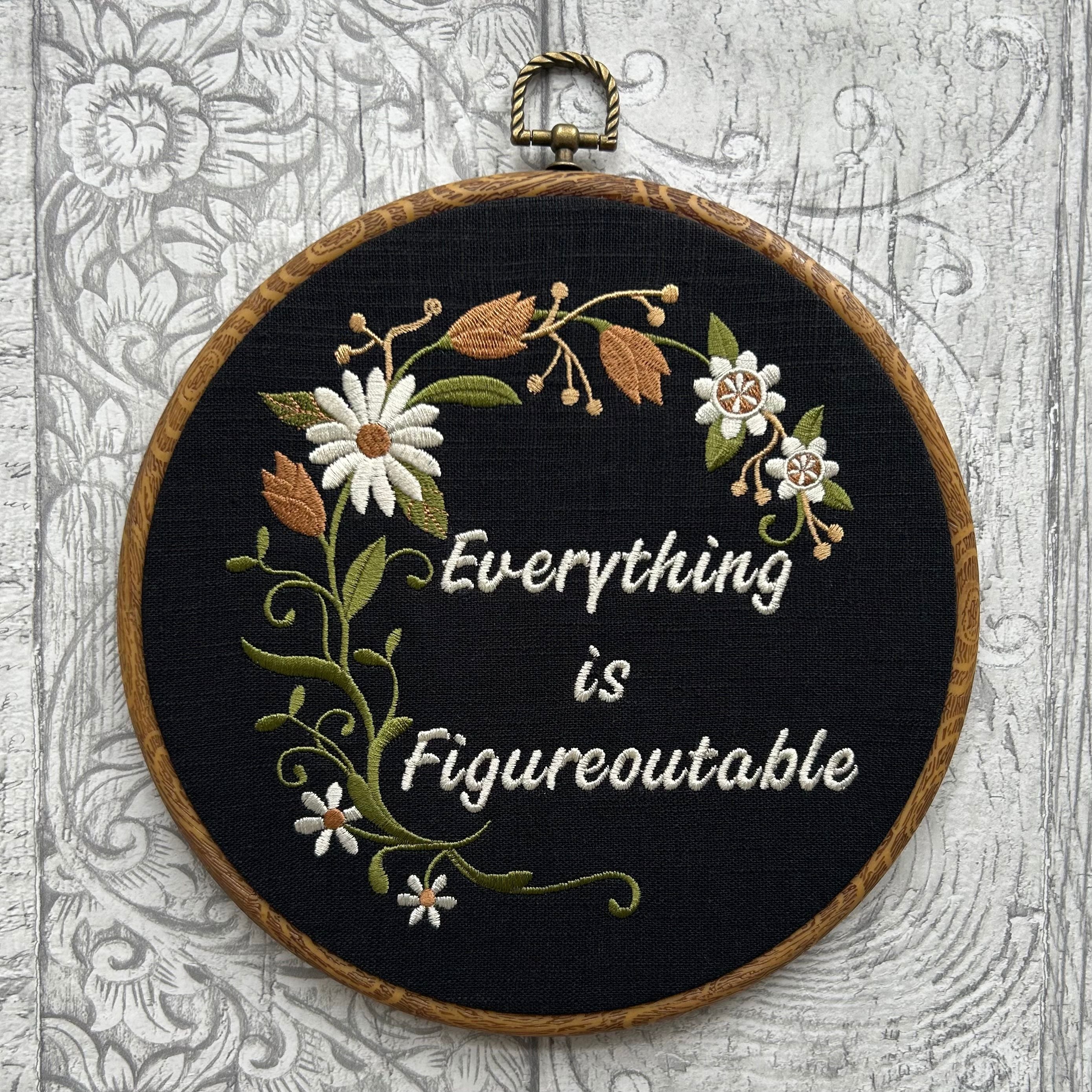Everything is Figureoutable embroidery hoop with hand-stitched floral design