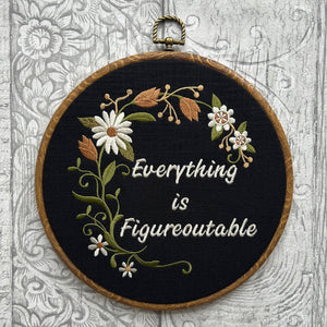 Everything is Figureoutable embroidery hoop with hand-stitched floral design