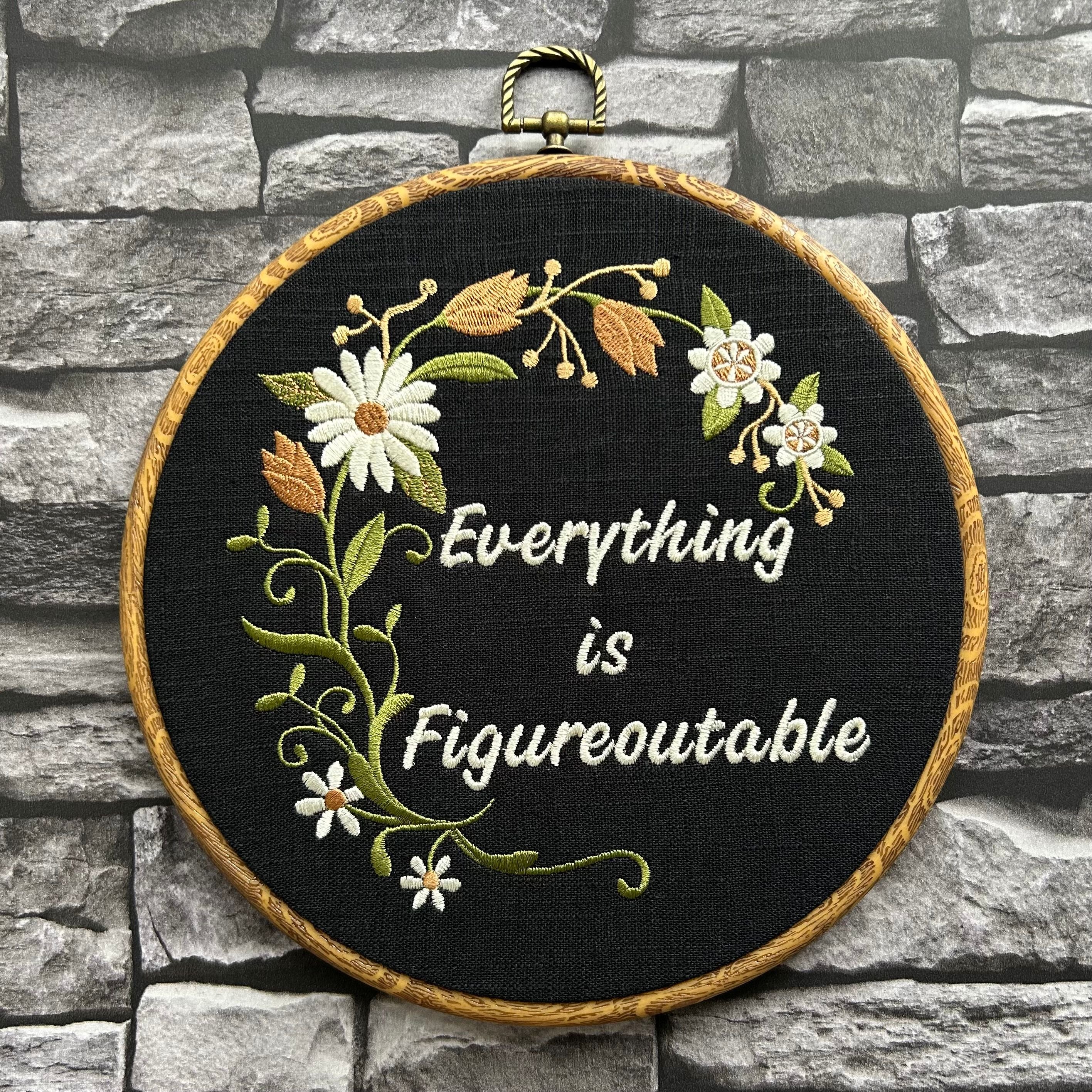 Handmade motivational embroidery wall art with daisies and vines