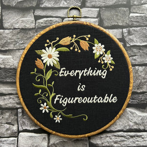 Handmade motivational embroidery wall art with daisies and vines
