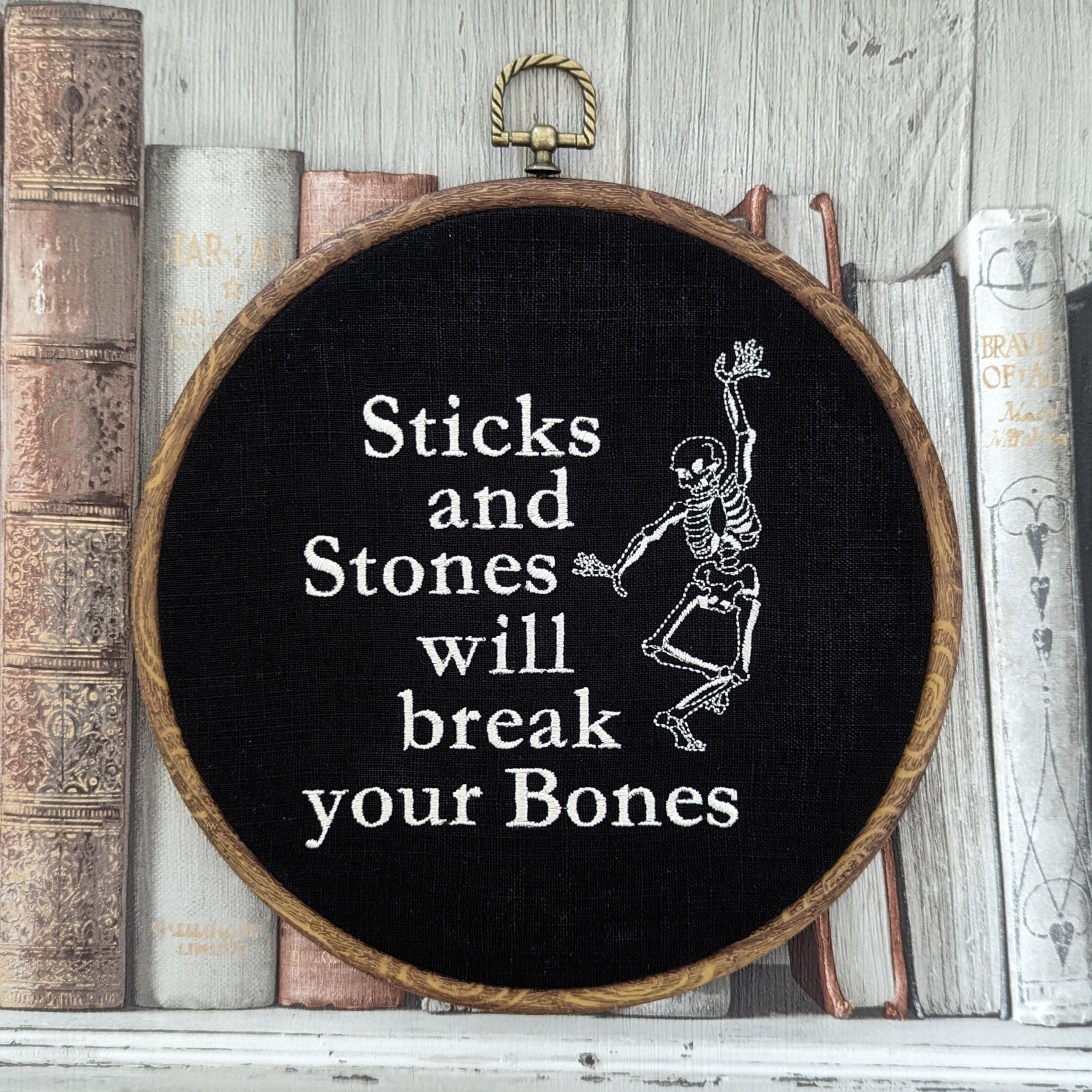 Sticks and stones will break your bones. Machine embroidered 8" hoop