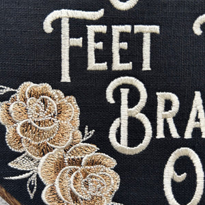 This stunning wall hanging features gold roses beautifully embroidered onto rich black linen, creating a bold and sassy statement piece. With a wood frame and a perfect blend of vintage charm and modern flair