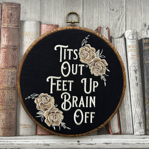 This stunning wall hanging features gold roses beautifully embroidered onto rich black linen, creating a bold and sassy statement piece. With a wood frame and a perfect blend of vintage charm and modern flair