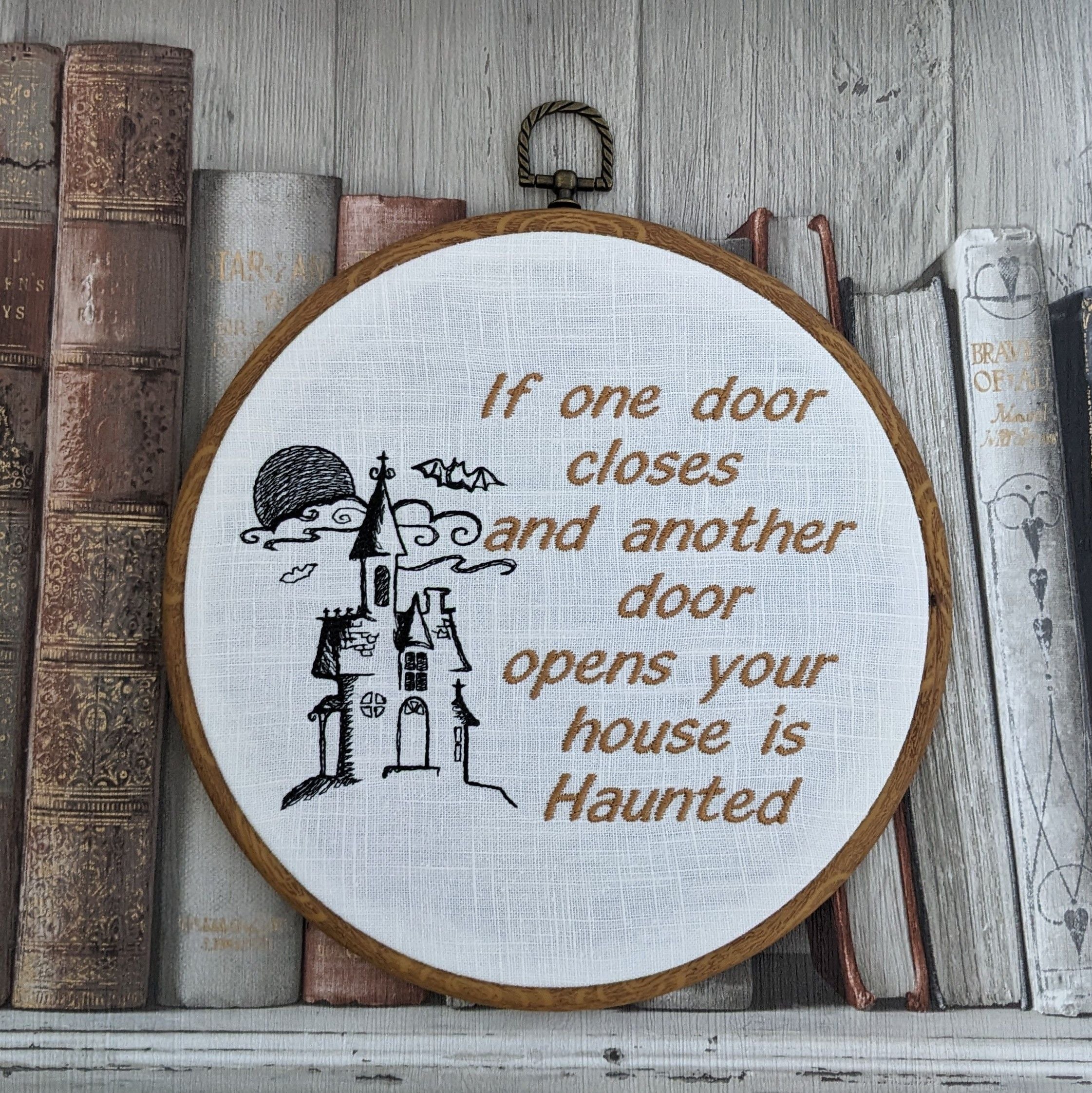 If one door closes and another door opens your house is Haunted. Machine embroidery 8" hoop art