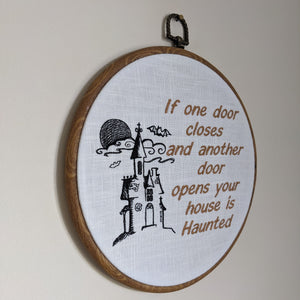 If one door closes and another door opens your house is Haunted. Machine embroidery 8" hoop art