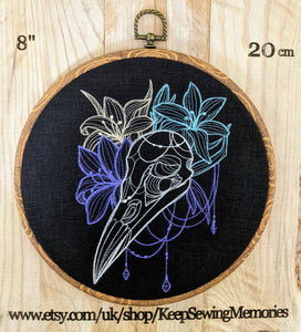 Bird skull with lilies.  Machine embroidered 8" hoop