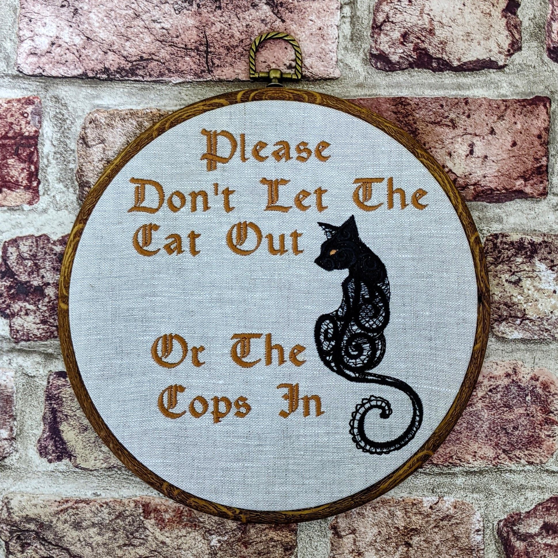 Please don't let the cat out or the cops in. Machine embroidery 8" hoop art