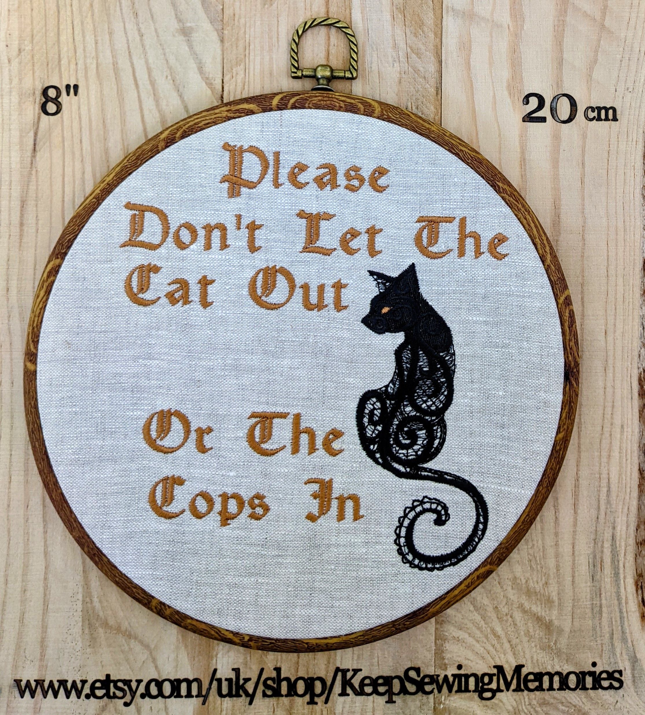 Please don't let the cat out or the cops in. Machine embroidery 8" hoop art