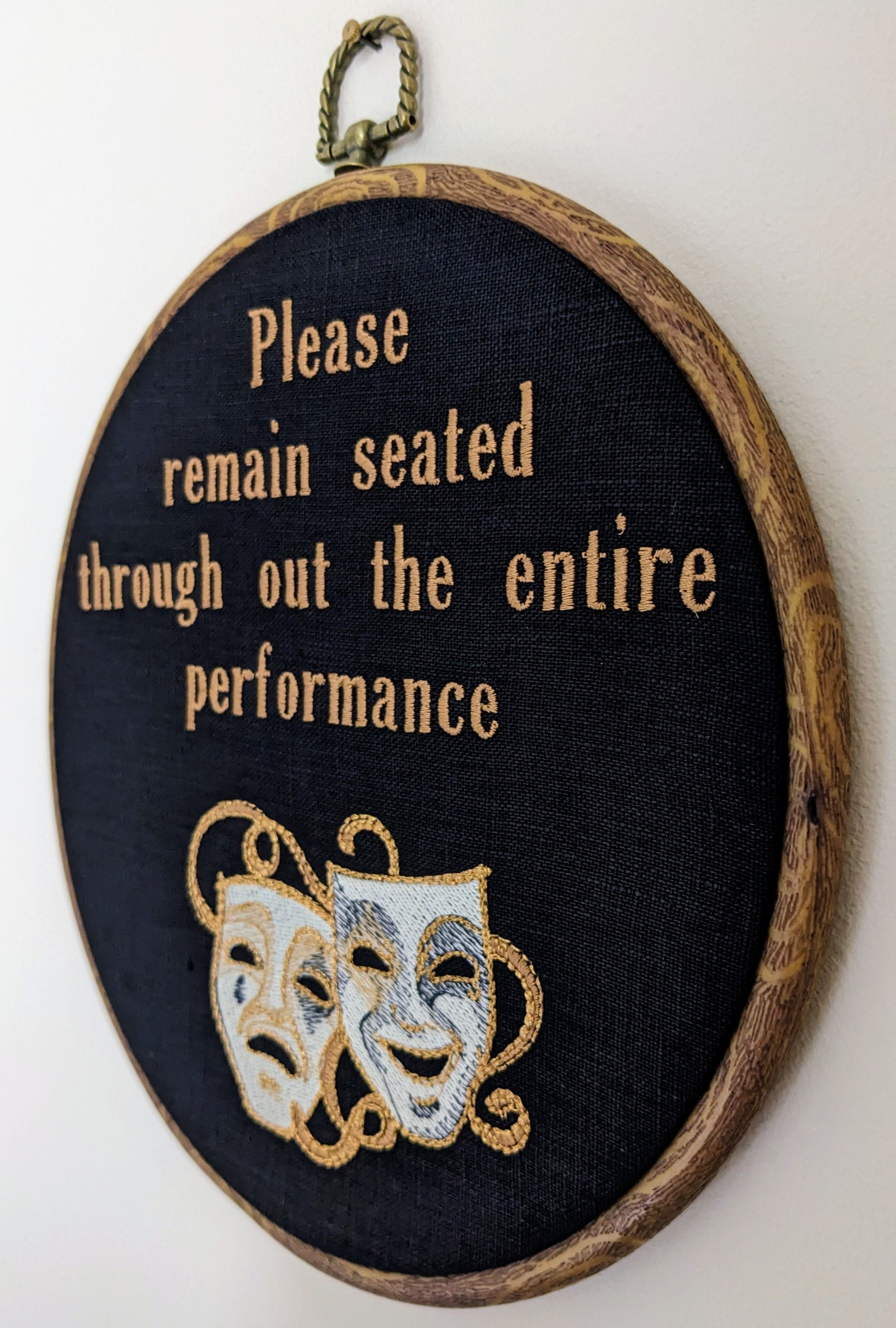 Please remain seated through out the entire performance hoop art. Machine embroidery 8" hoop. Gothic décor, bathroom décor.