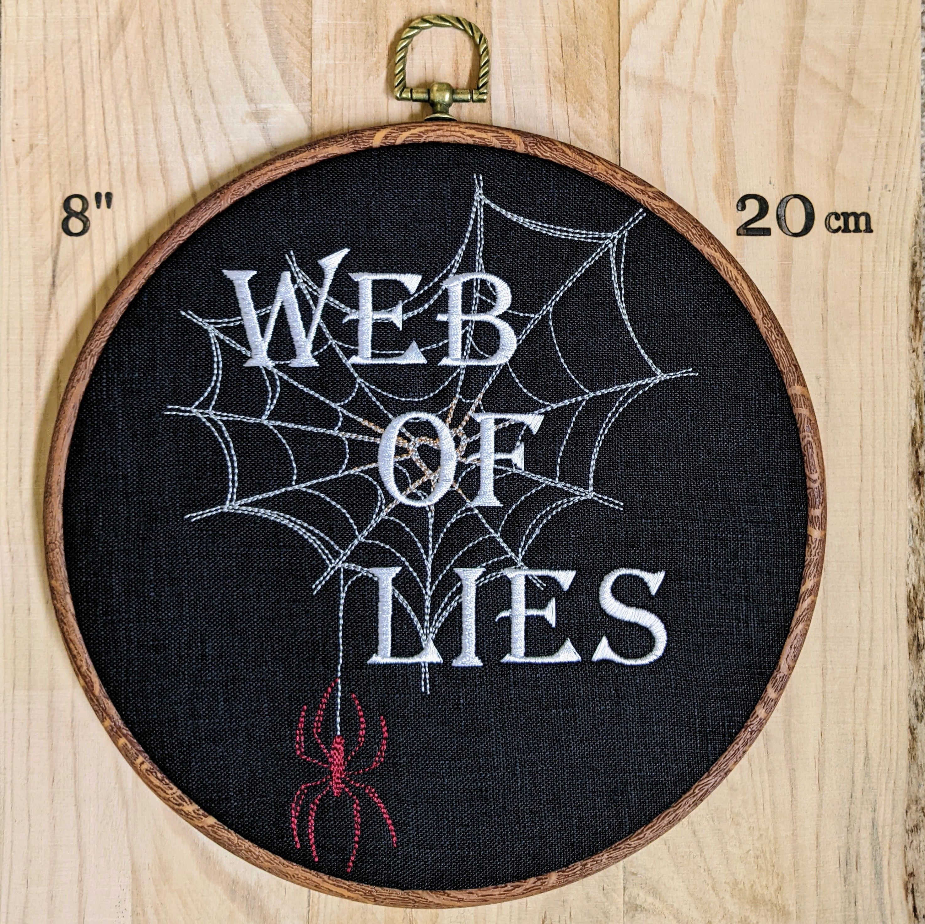 Web of lies. Machine embroidered 8" hoop art