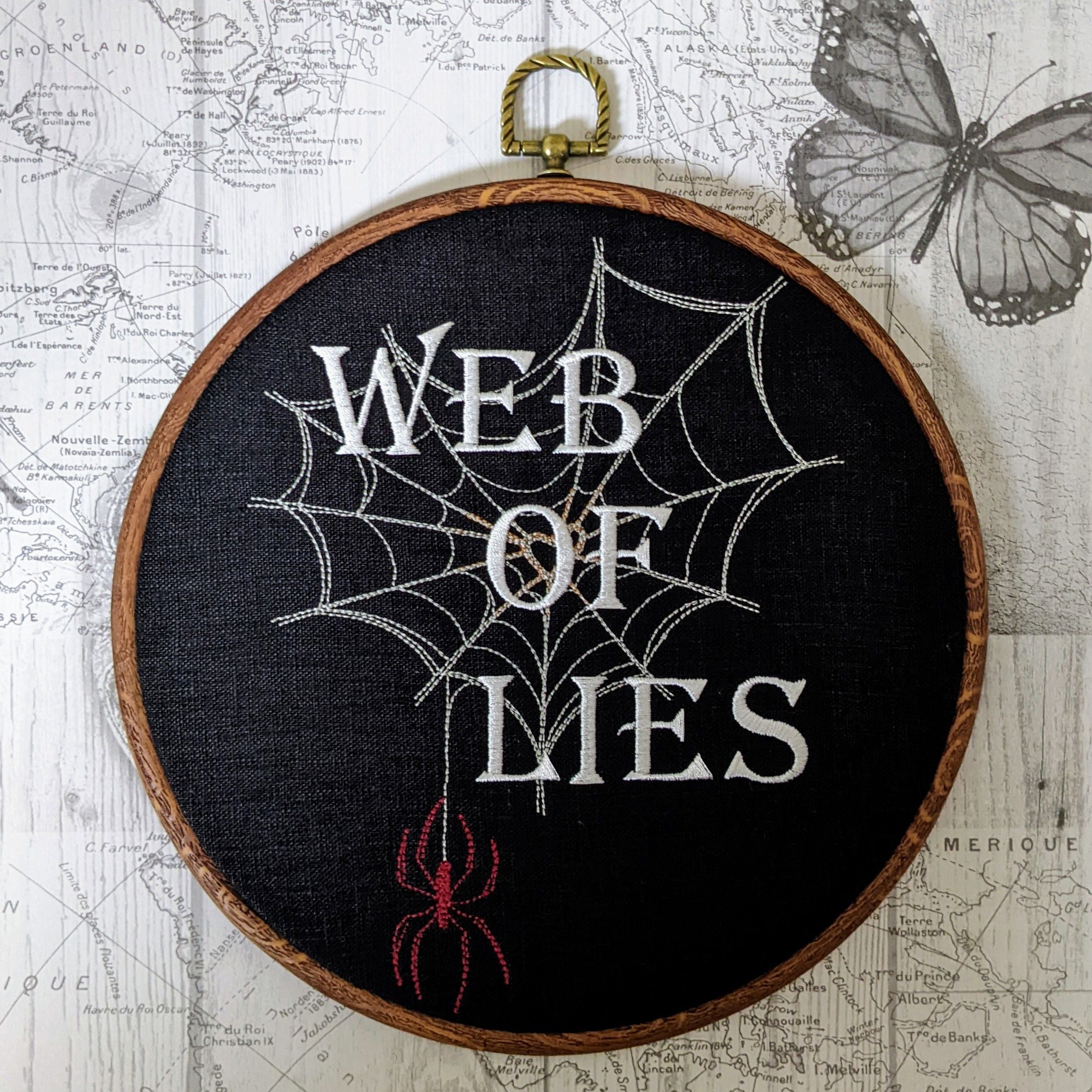 Web of lies. Machine embroidered 8" hoop art