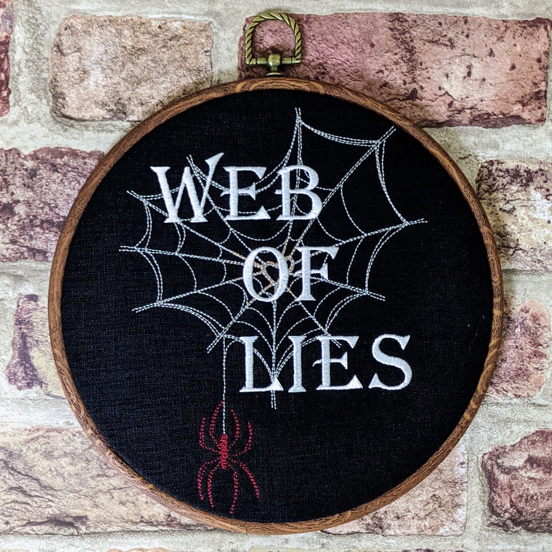 Web of lies. Machine embroidered 8" hoop art