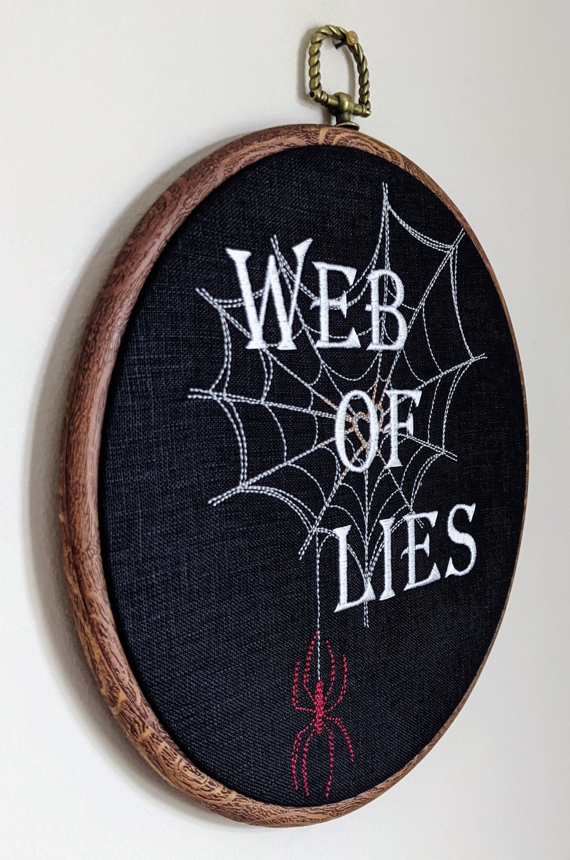 Web of lies. Machine embroidered 8" hoop art