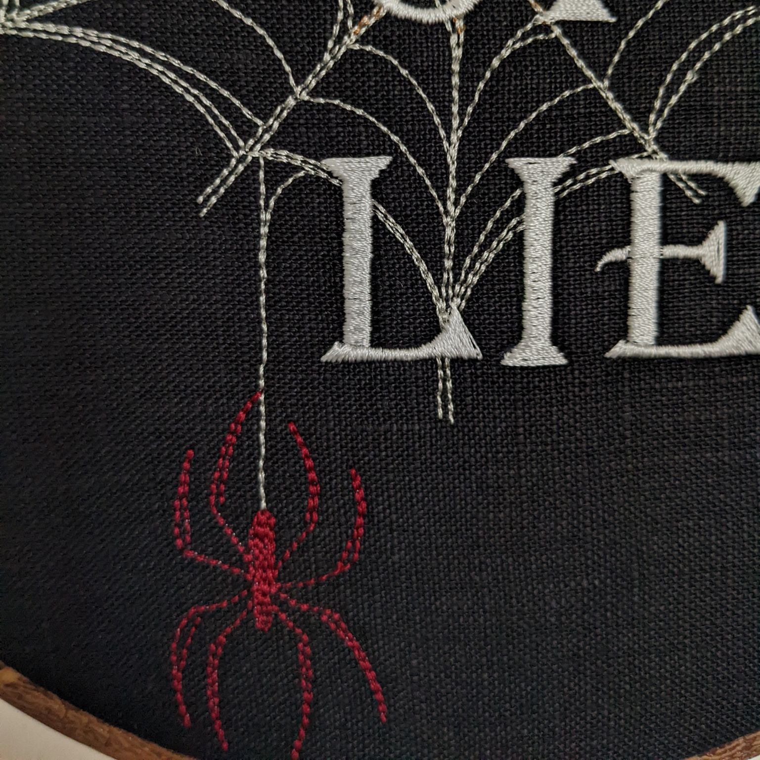 Web of lies. Machine embroidered 8" hoop art